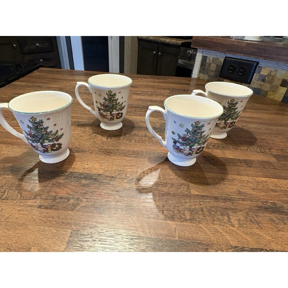 Set of 4 set of Nikko Happy Holidays Footed Coffee Cups.